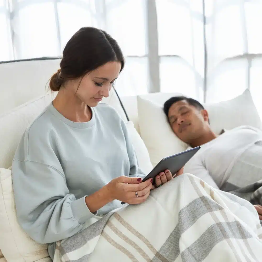 couple relaxing in adjustable bed