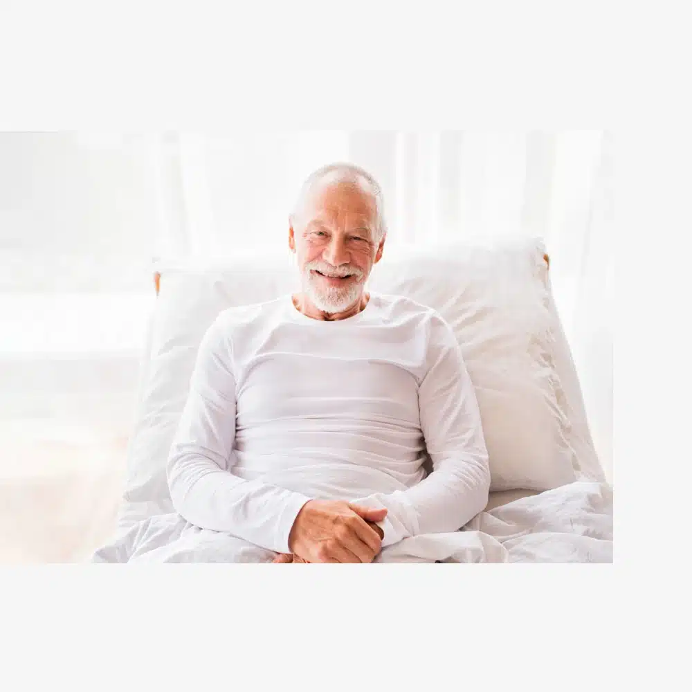 senior citizen in adjustable bed